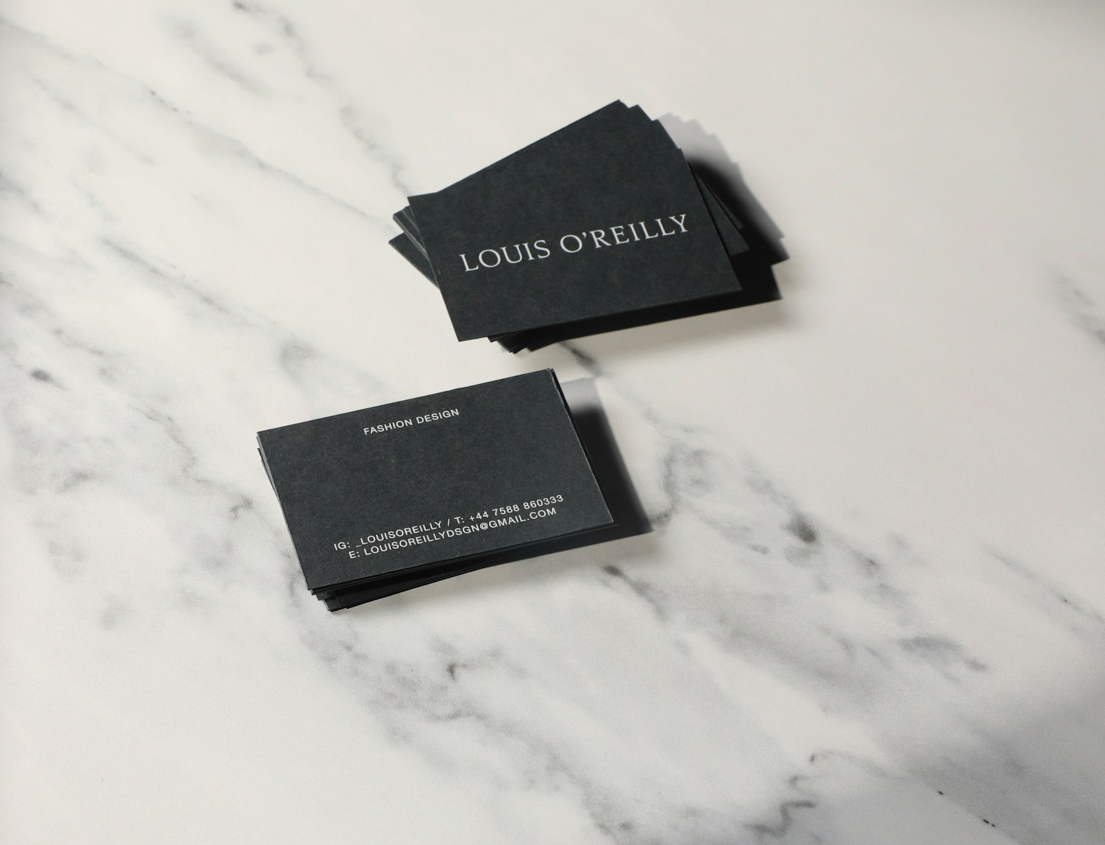 Premium business cards on a marble surface