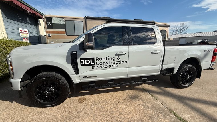 Pickup truck door graphics for a roofing company