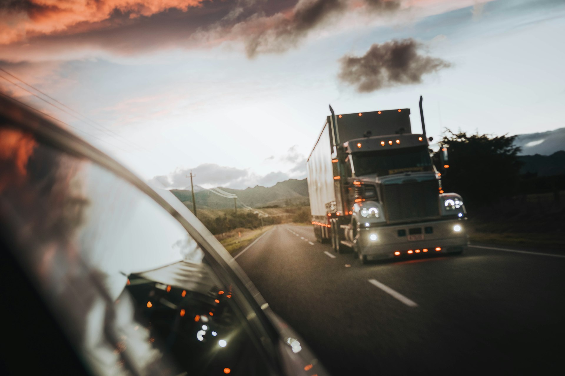 Truck on the road at sunset